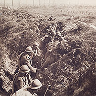 Belgian infantry soldiers with bayonets fixed to rifles waiting in trench to charge the Germans during the First World War in Flanders, Belgium 