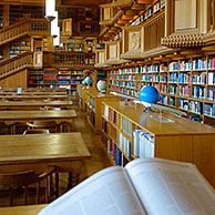 Interior showing large bookshelves with collections of books at the university library of Leuven / Louvain, Belgium