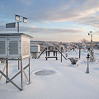 Weather station measuring temperature, wind speed and precipitation at Mont Rigi in the snow in winter in the High Fens / Hautes Fagnes, Belgian Ardennes, Belgium